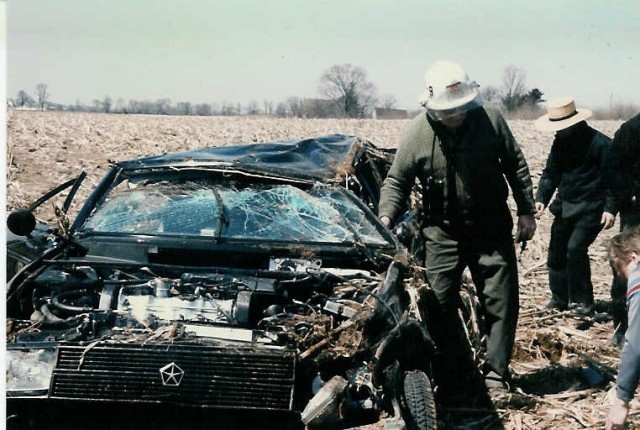 Chief Parmer examines the results of a rollover crash on Route 897 at Elam Road in 1986.